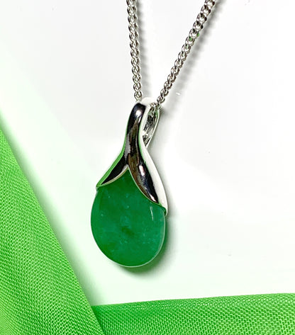 A real green jade necklace in a tear drop or pear shape