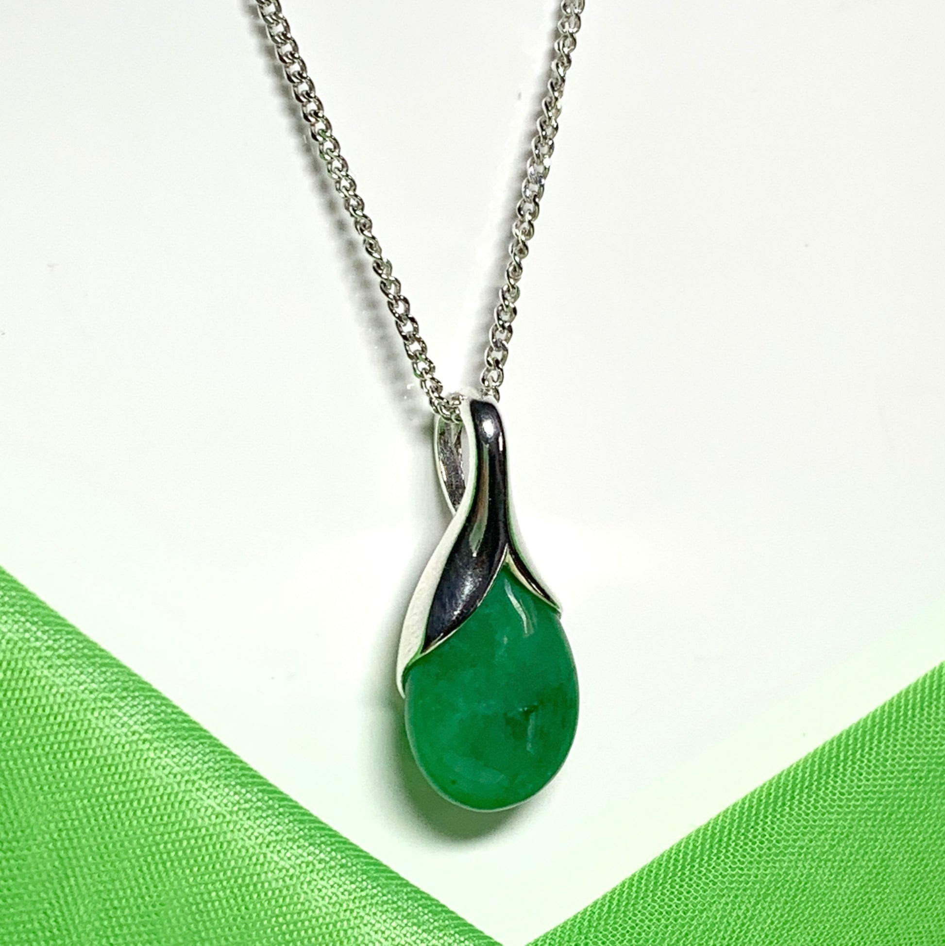 A real green jade necklace in a tear drop or pear shape pendant