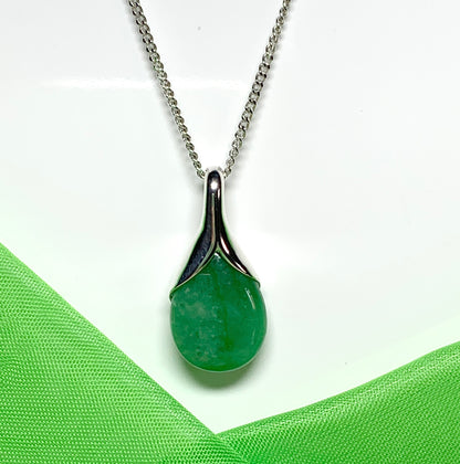 A real green jade necklace in a teardrop or pear shaped