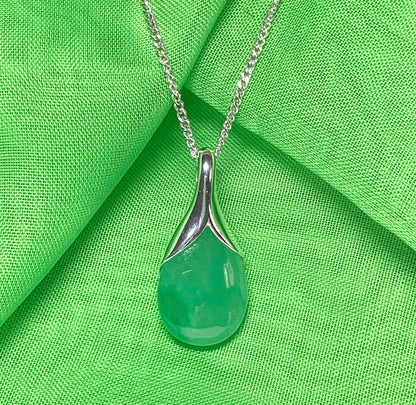 A real green jade necklace in a teardrop shaped or pear shape