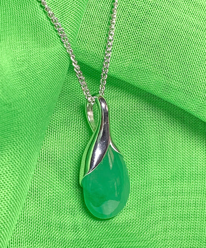 A real green jade necklace in a teardrop shaped or pear shape