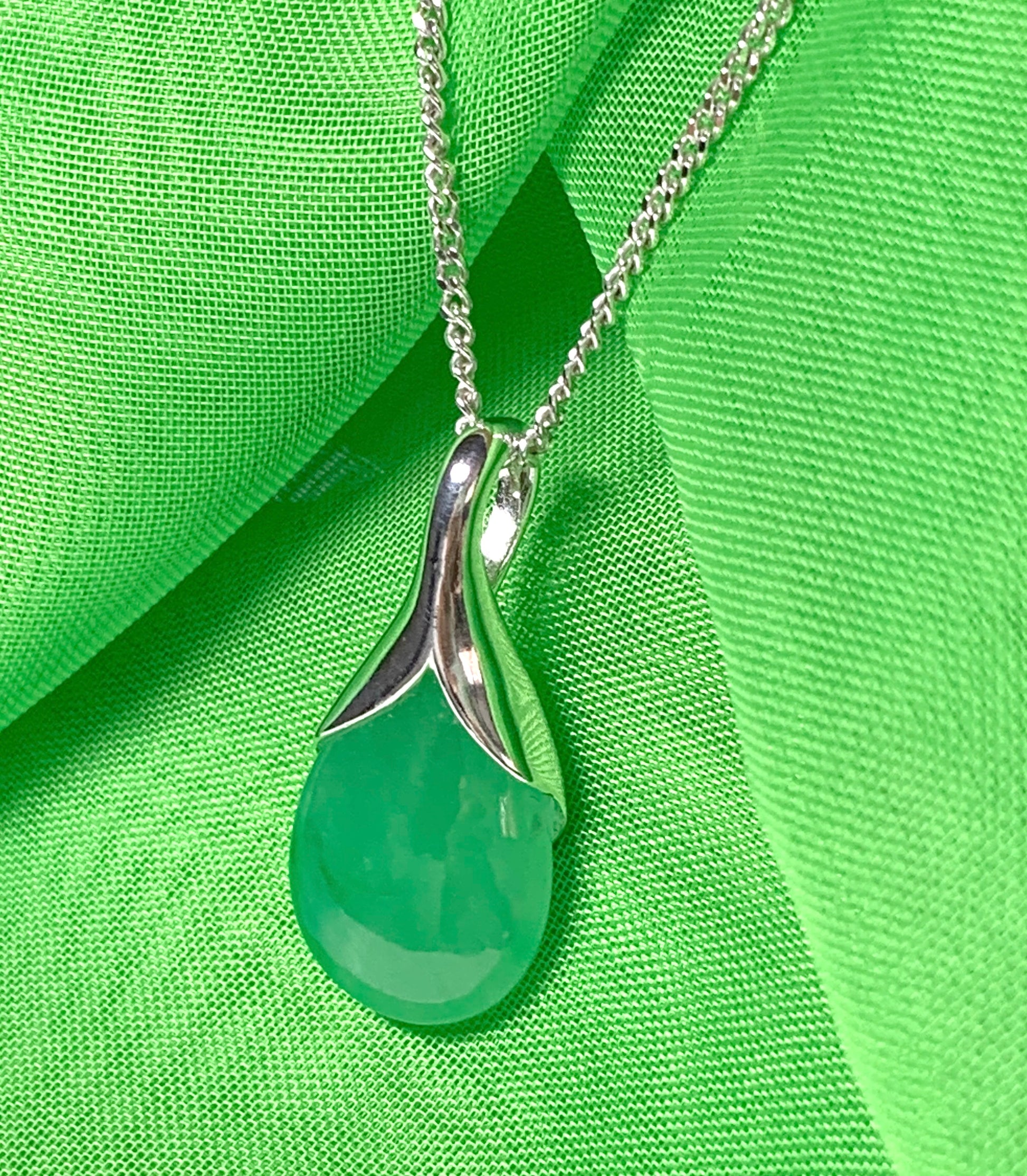 A real green jade necklace in a teardrop shaped or pear shape