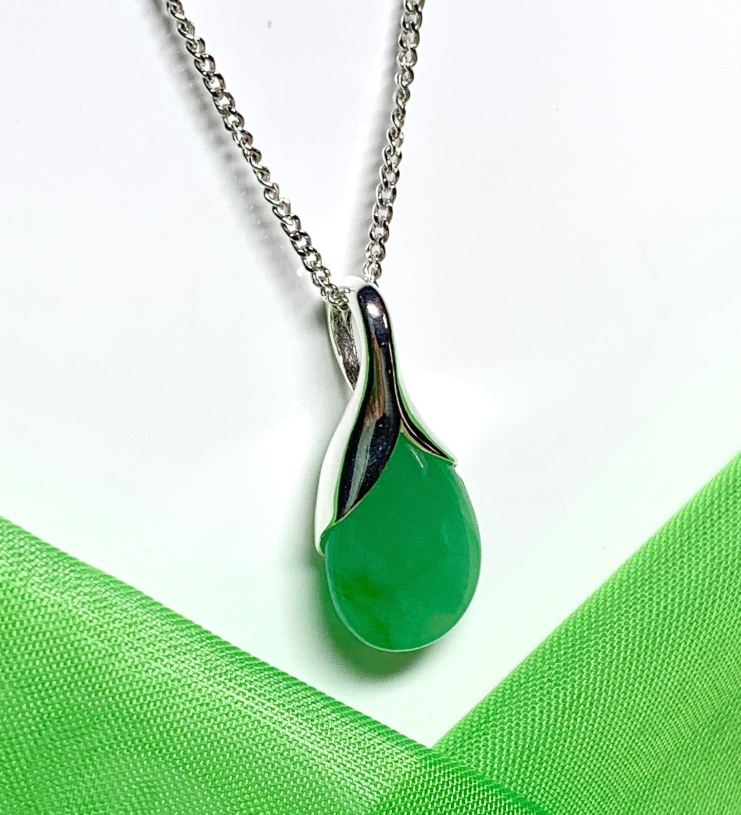 A real green jade necklace in a teardrop shaped or pear shape