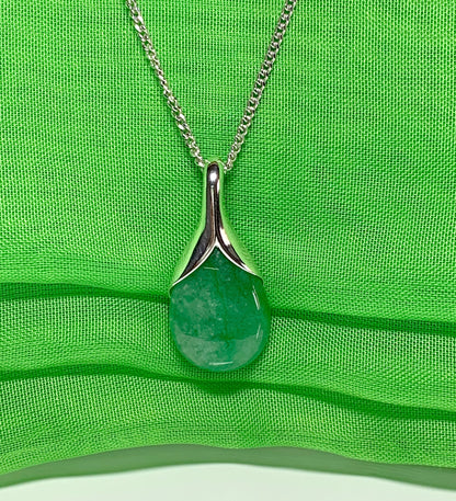 A real green jade necklace in a teardrop or pear shaped