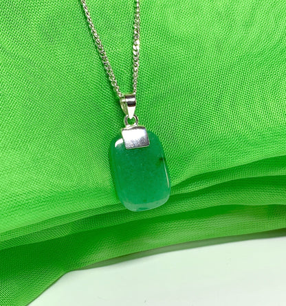 A real green jade sterling silver cushion shaped pendant