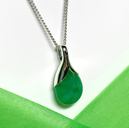 A real green jade necklace in a tear drop or pear shape