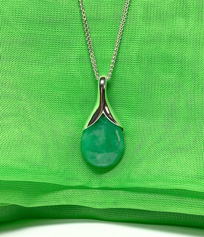 A real green jade necklace in a tear drop or pear shape pendant