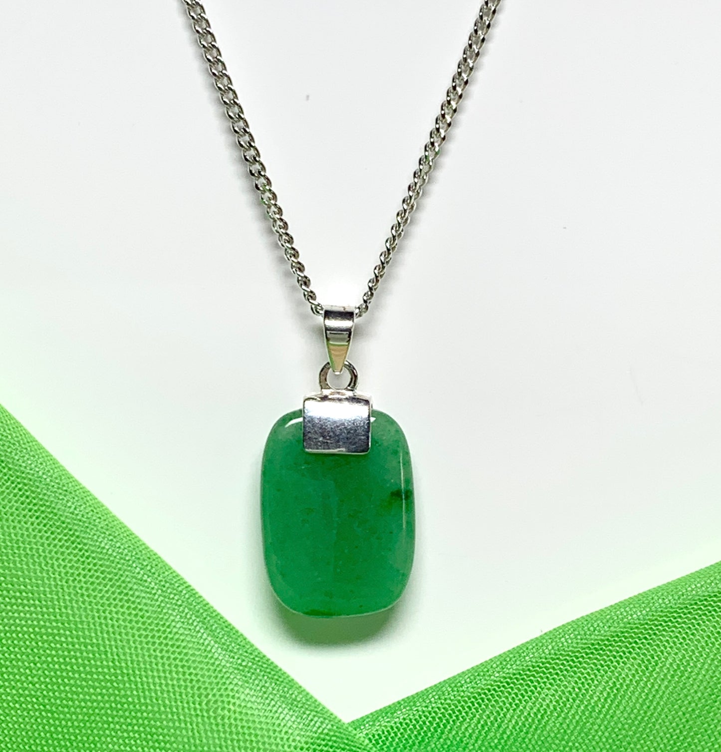 A real green jade sterling silver cushion shaped pendant