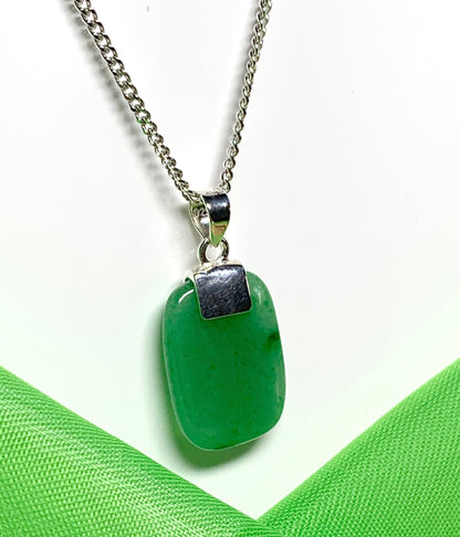 A real green jade sterling silver cushion shaped pendant