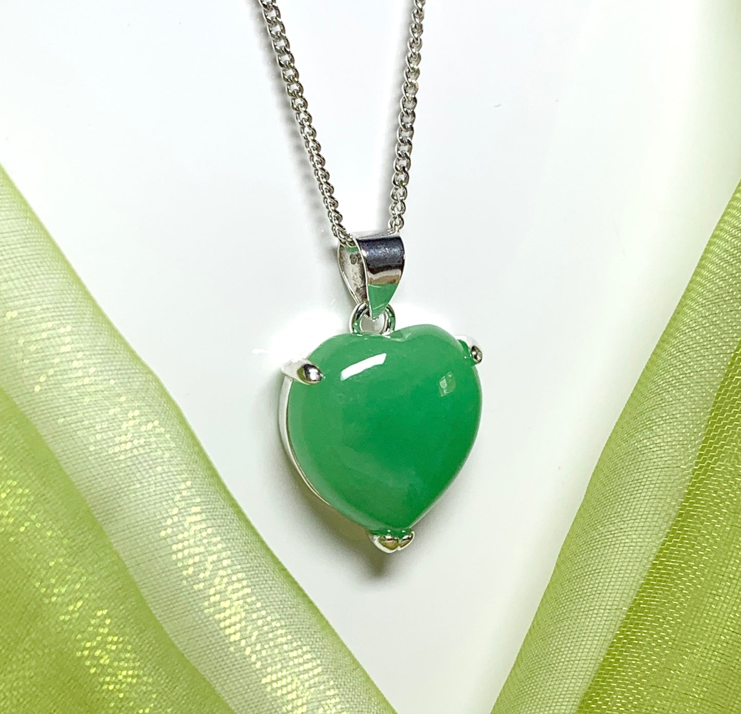 A really stunning real green jade necklace heart shaped sterling silver pendant