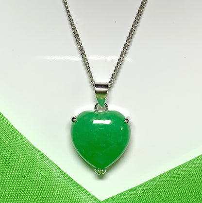 A stunning real green jade necklace heart shaped sterling silver pendant