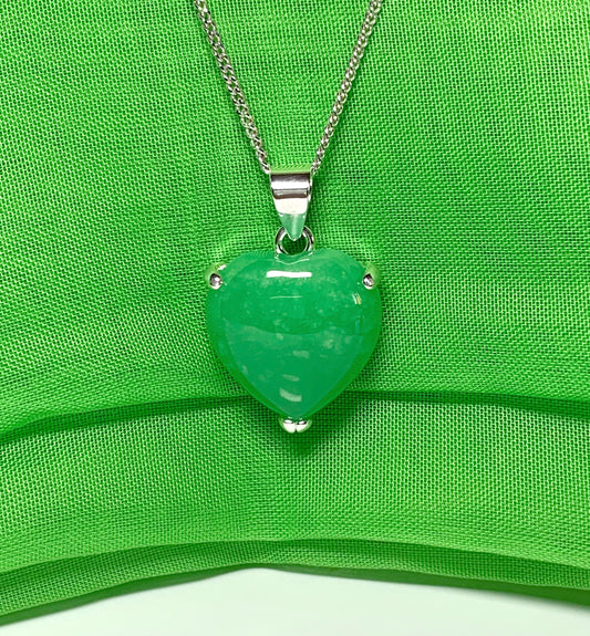 A stunning real green jade necklace heart shaped sterling silver pendant