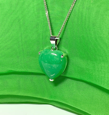 A stunning real green jade necklace heart shaped sterling silver pendant