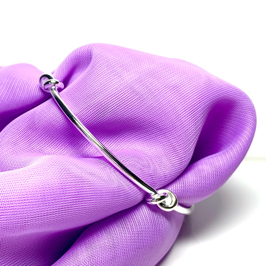 Bangle sterling silver knotted solid round with a classic knot design