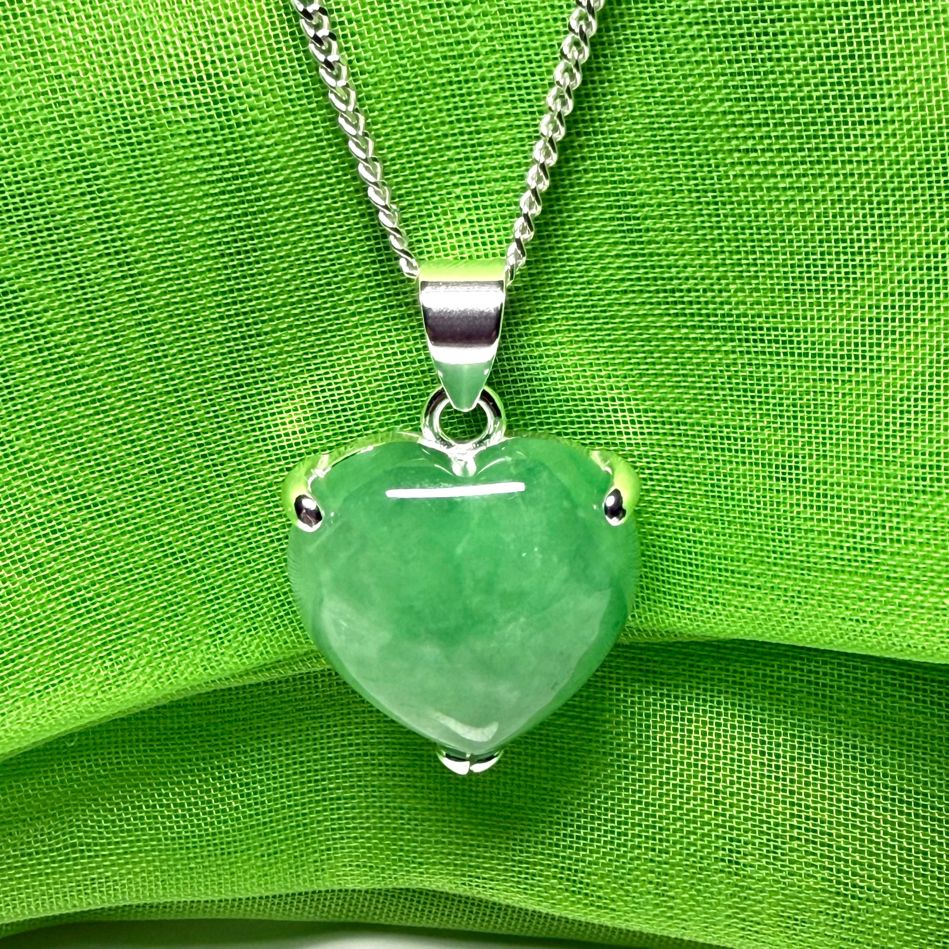 A beautiful and stunning real green jade necklace heart shaped sterling silver pendant