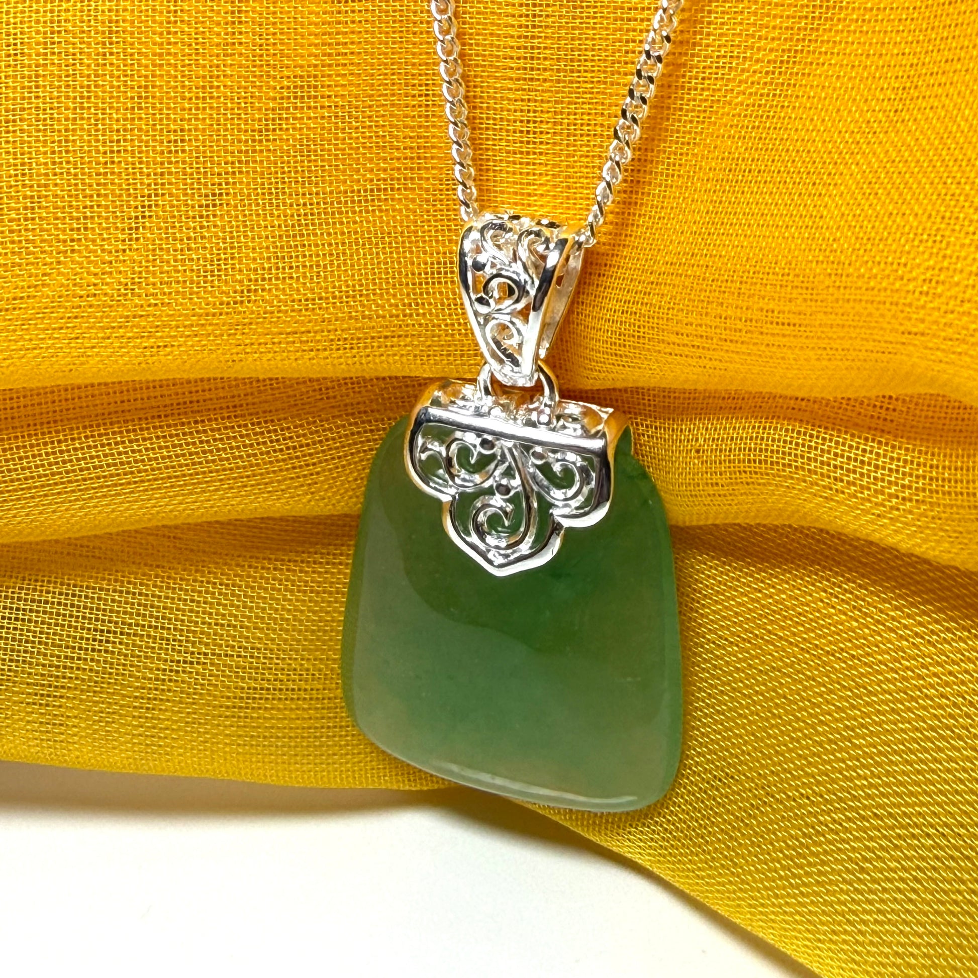 Beautiful and timeless real green jade necklace large pendant that is cushion shaped