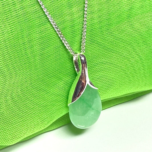 A beautiful real green jade necklace teardrop with a pear shaped pendant, a distinctive design