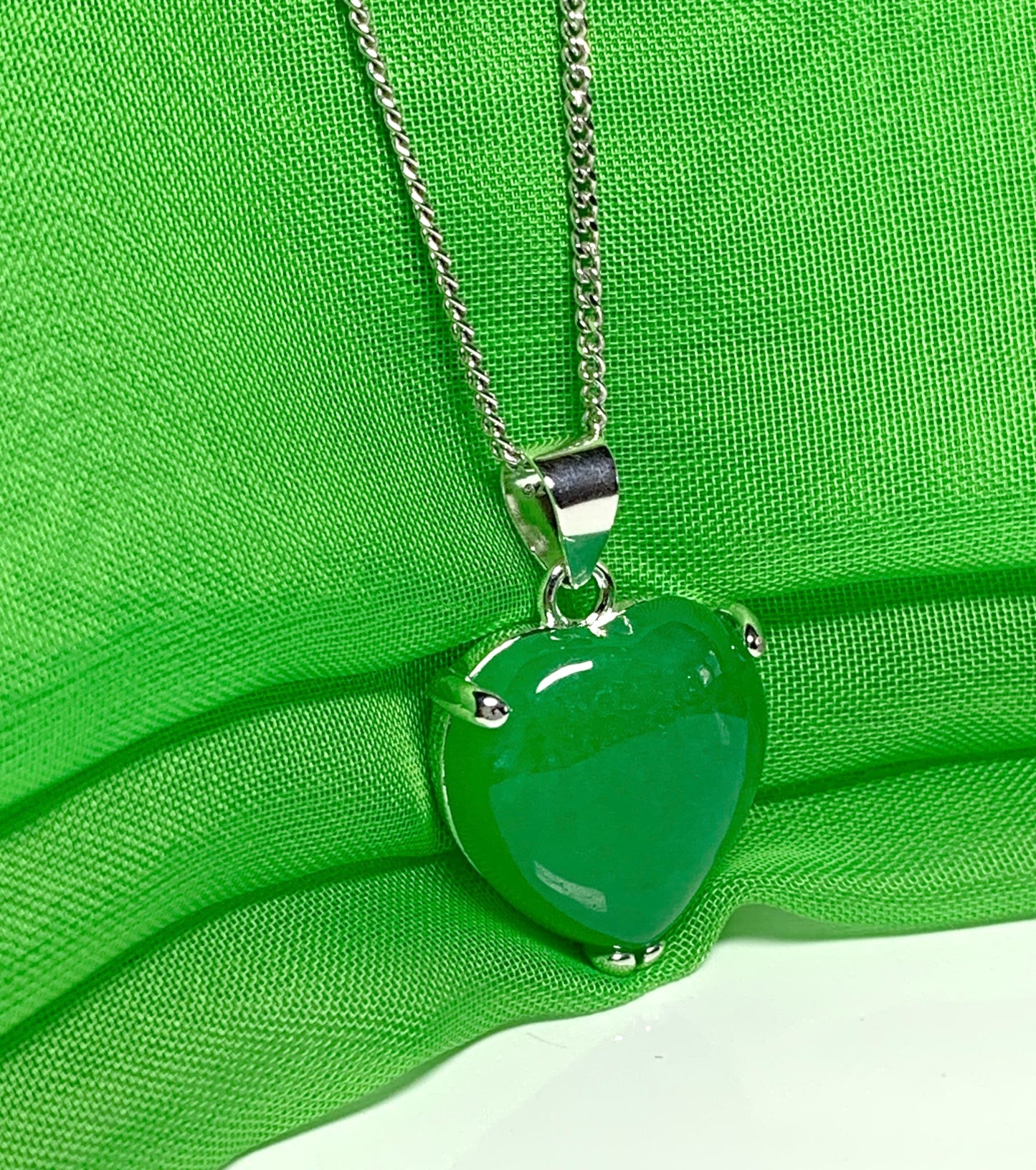 A beautiful real green jade necklace heart shape sterling silver pendant