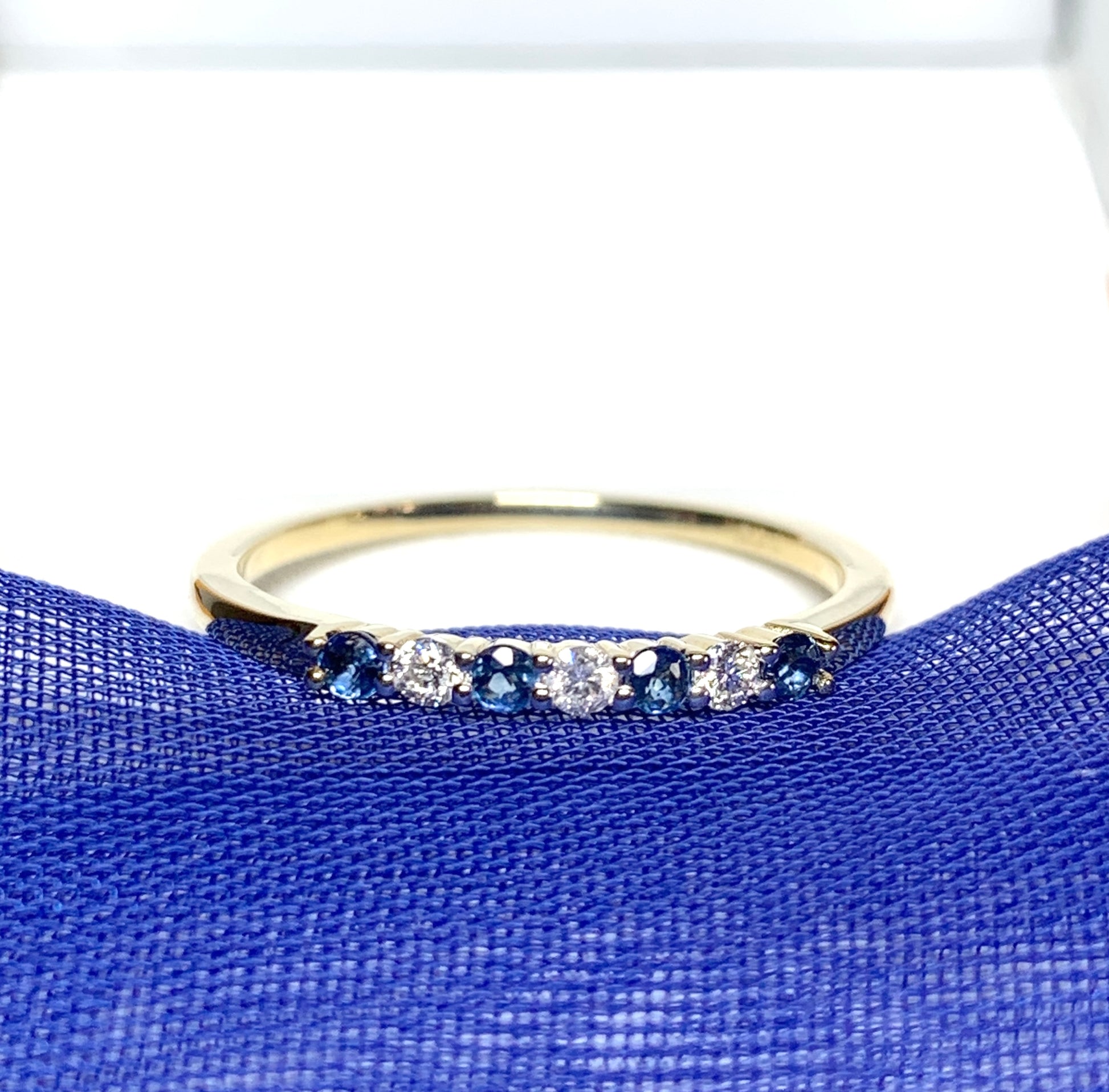 Blue Sapphire And Diamond Claw Set Eternity Ring