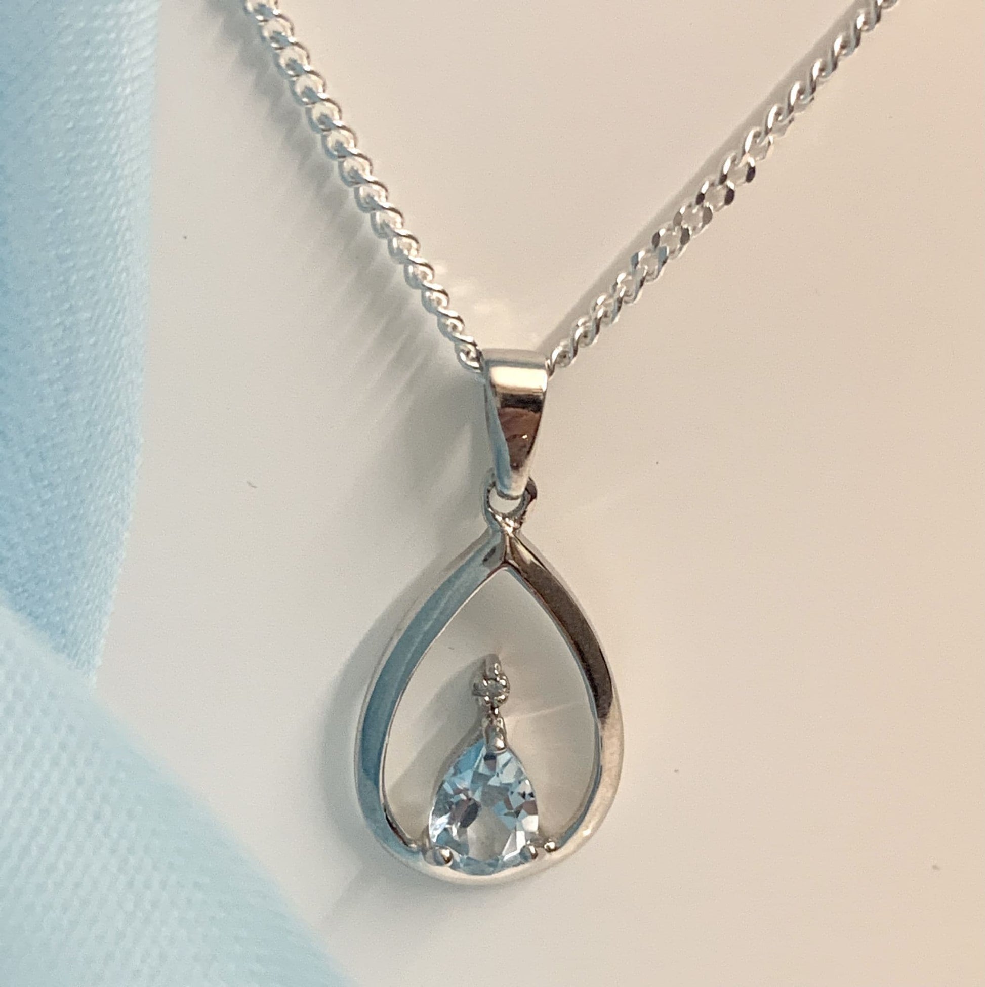 Blue Topaz Pear Shaped Sterling Silver Diamond Set Necklace Pendant