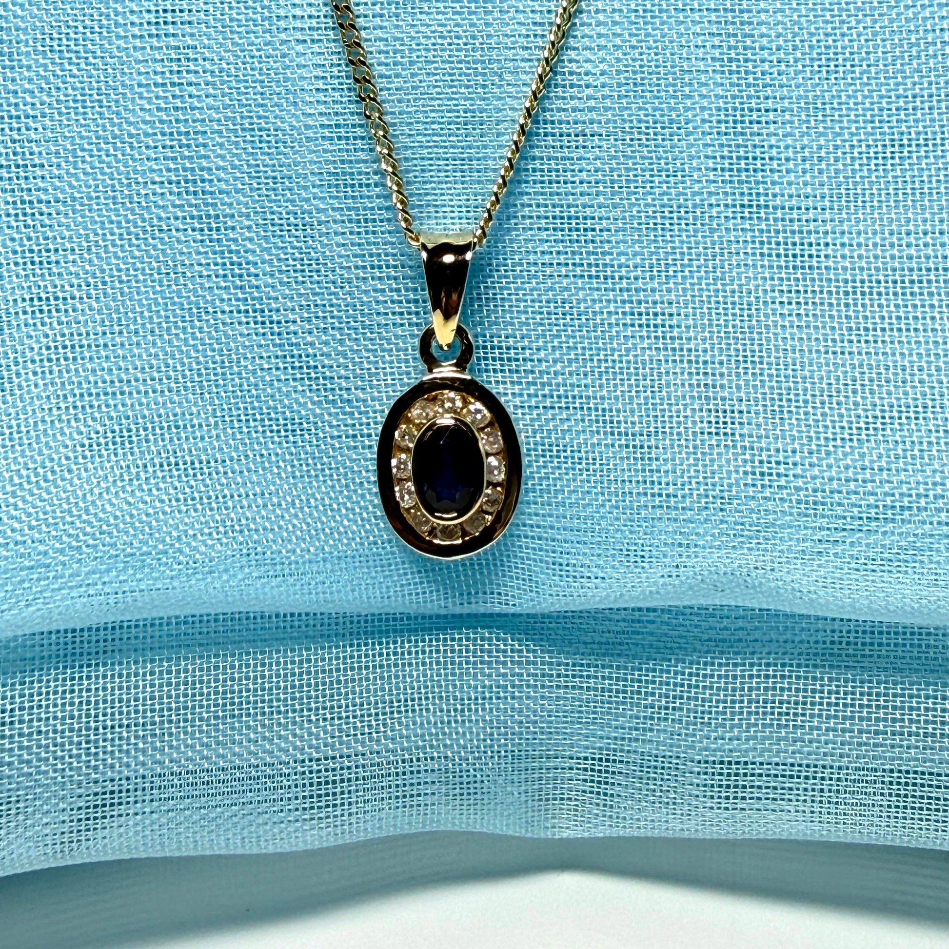 Blue real dark blue sapphire and diamond necklace yellow gold oval shaped cluster pendant