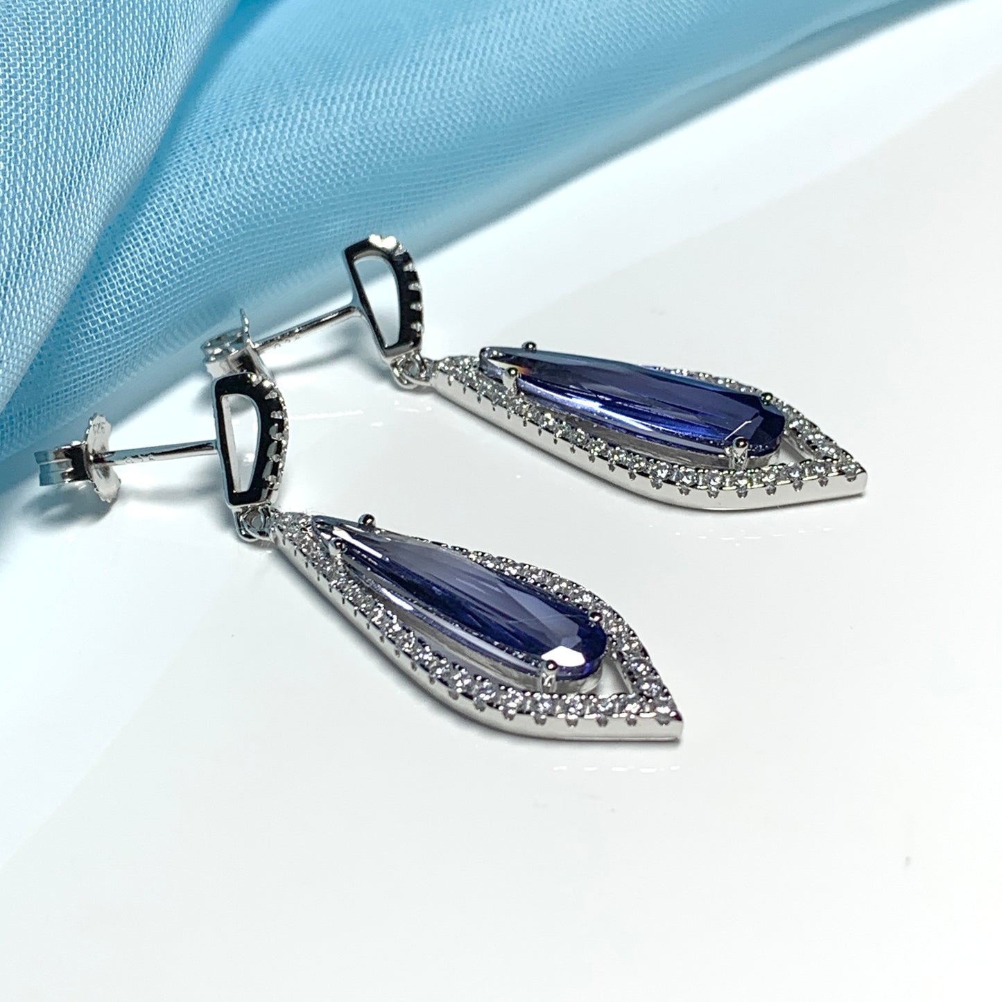Blue pear shaped cubic zirconia silver cluster long drop earrings