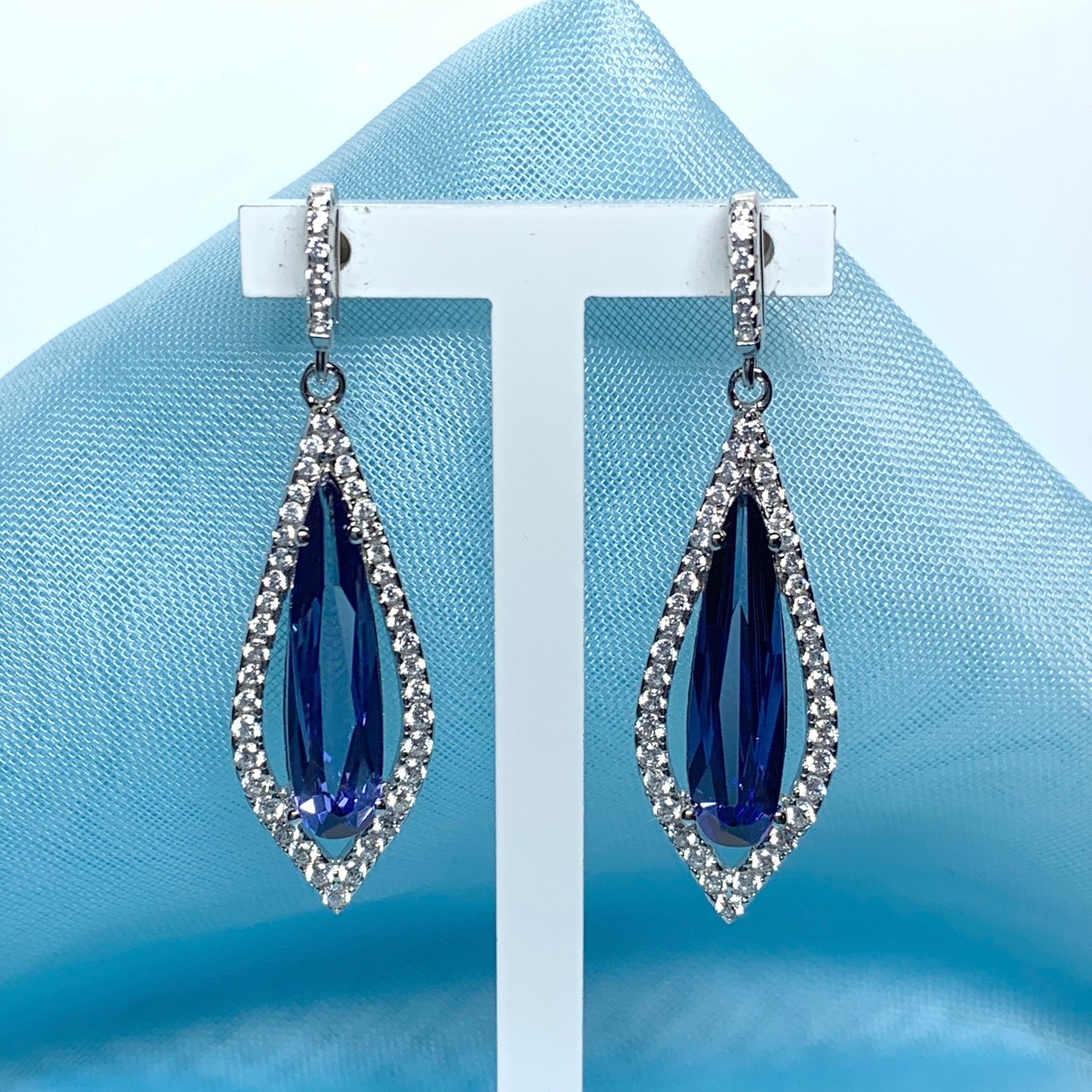 Blue pear shaped cubic zirconia silver cluster long drop earrings