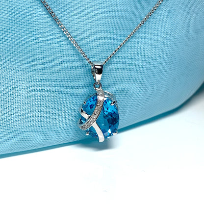 Blue topaz and diamond necklace white gold fancy oval shaped pendant