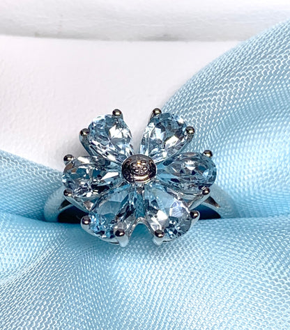 Blue topaz diamond round sterling silver daisy petal cluster ring