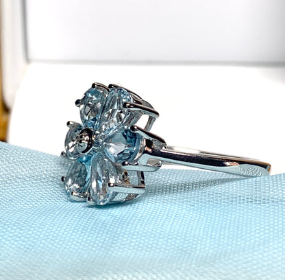 Blue topaz diamond round sterling silver daisy petal cluster ring