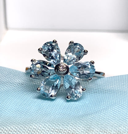 Blue topaz diamond round sterling silver daisy petal cluster ring