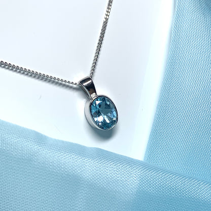 Blue topaz oval necklace white gold pendant