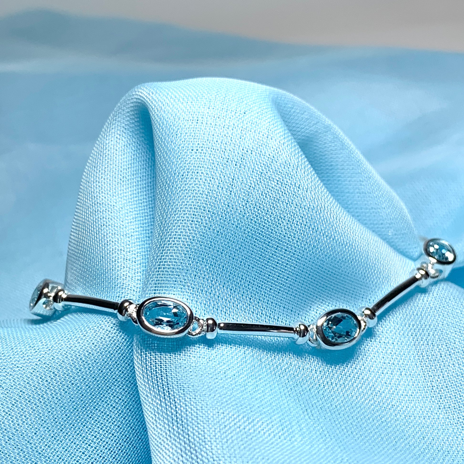 Blue topaz oval sterling silver bracelet