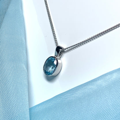 Blue topaz oval necklace white gold pendant