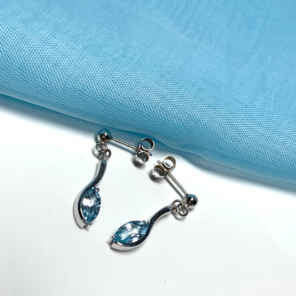 Blue topaz white gold marquise shaped fancy swirl drop earrings