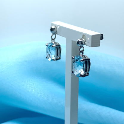 Blue topaz white gold oval drop earrings