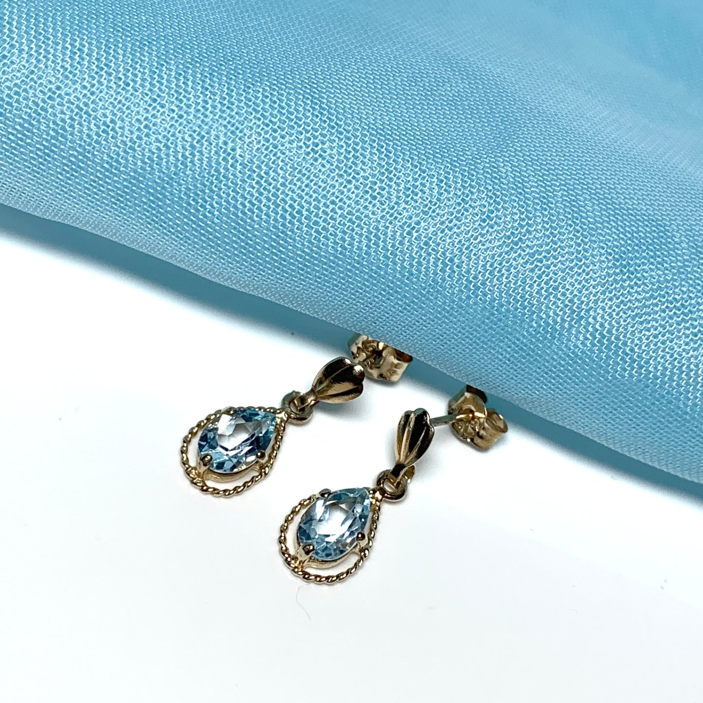 Blue topaz yellow gold oval shaped fancy drop earrings