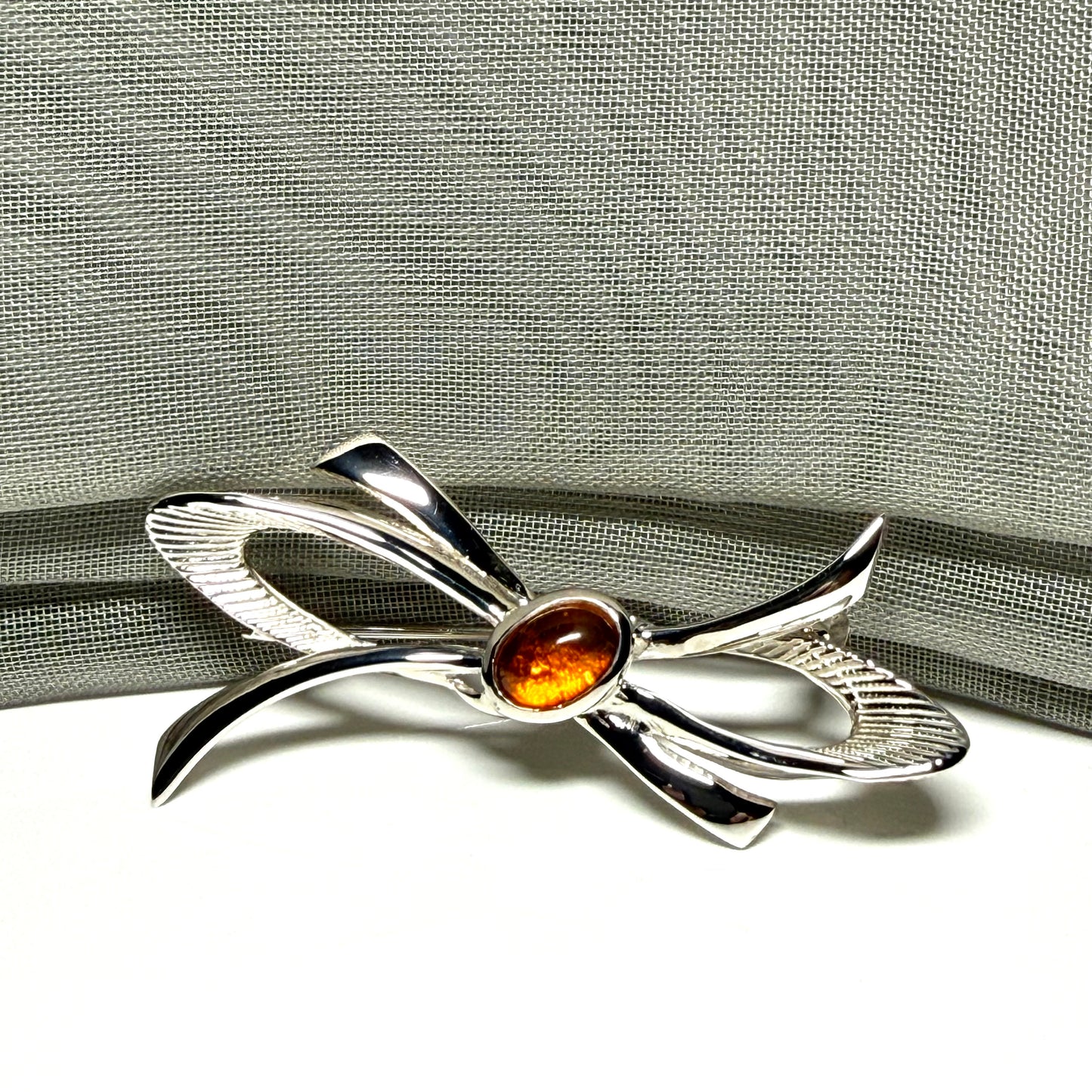 Bow Shaped Sterling silver real amber brooch