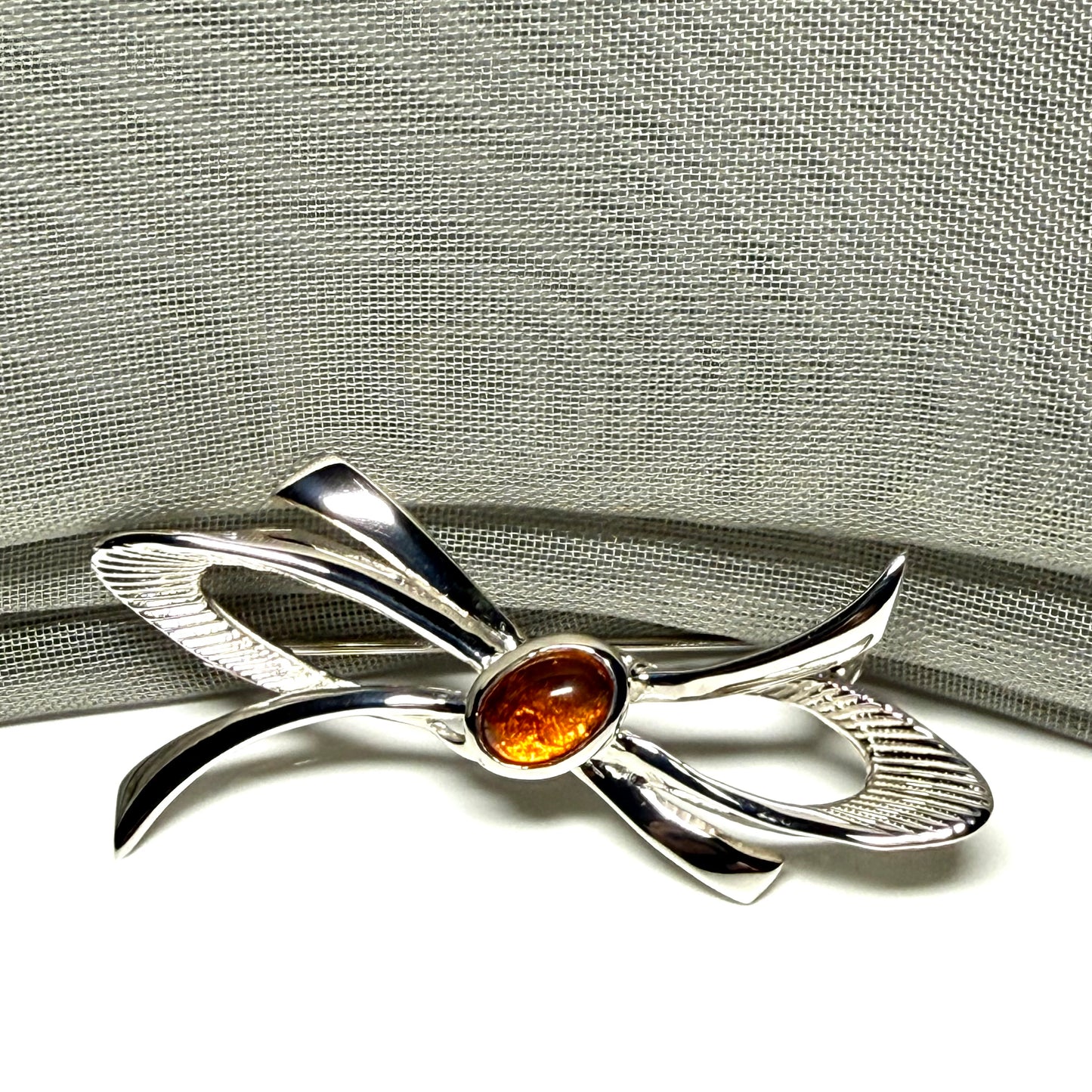 Bow Shaped Sterling silver real amber brooch