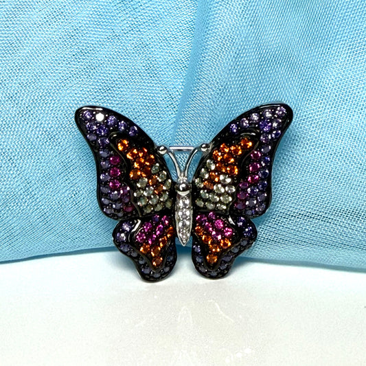 Butterfly brooch set with purple and multicoloured cubic zirconia stones