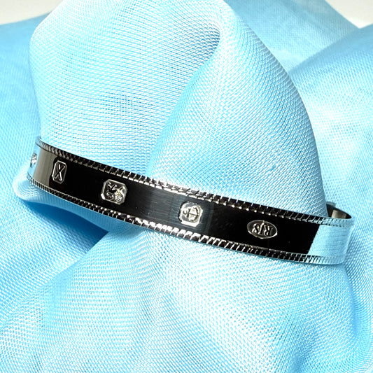 Childs medium expanding bangle sterling silver with a Hallmark feature design diamond cut edge