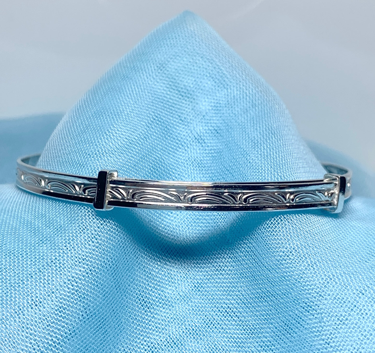Child’s expanding bangle swirl patterned design sterling silver