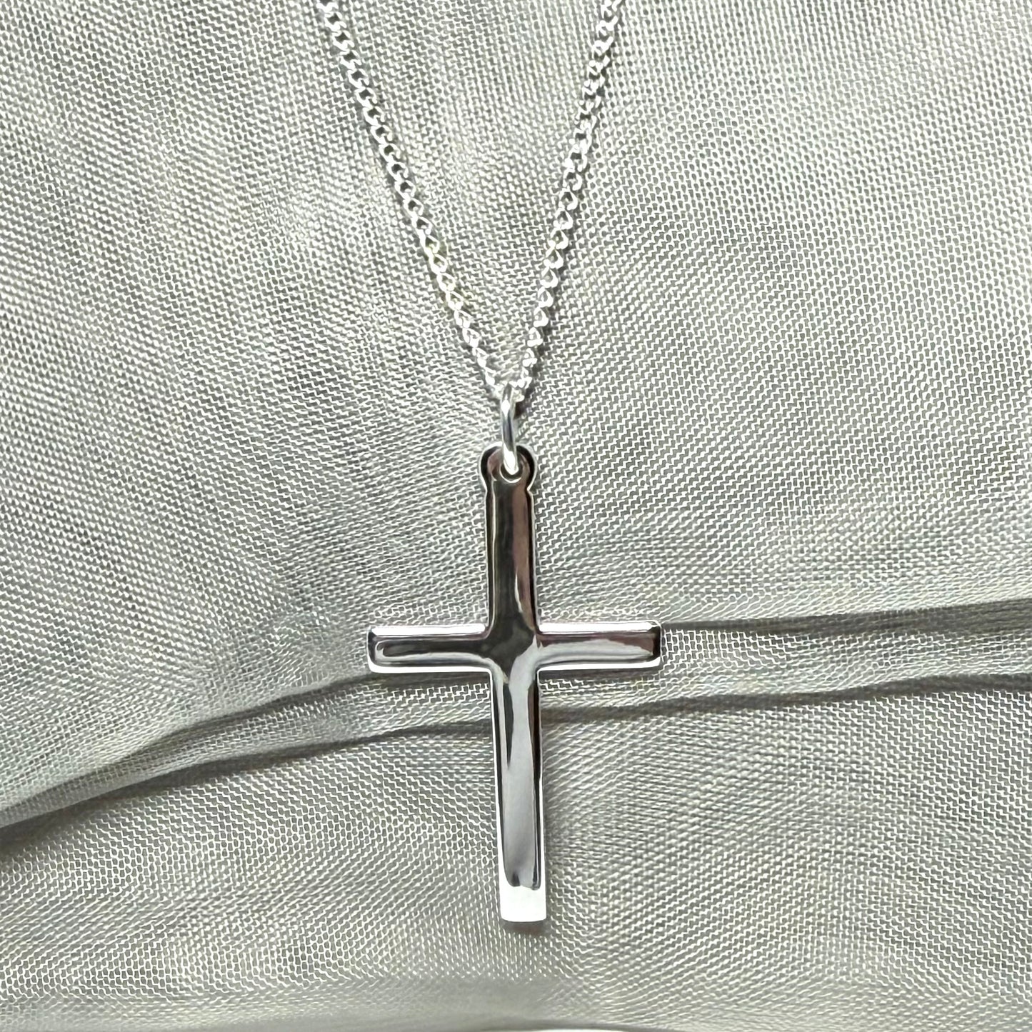 Cross and chain highly polished with a round pendant loop on top