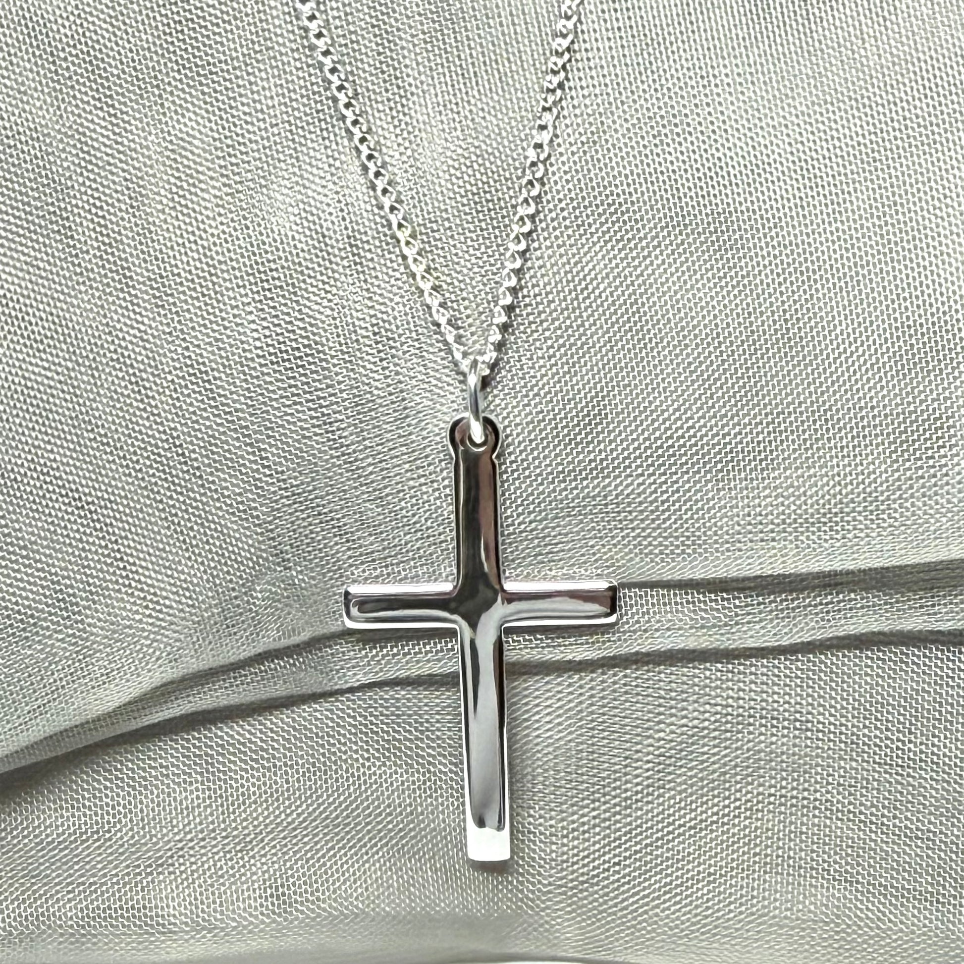 Cross and chain highly polished with a round pendant loop on top
