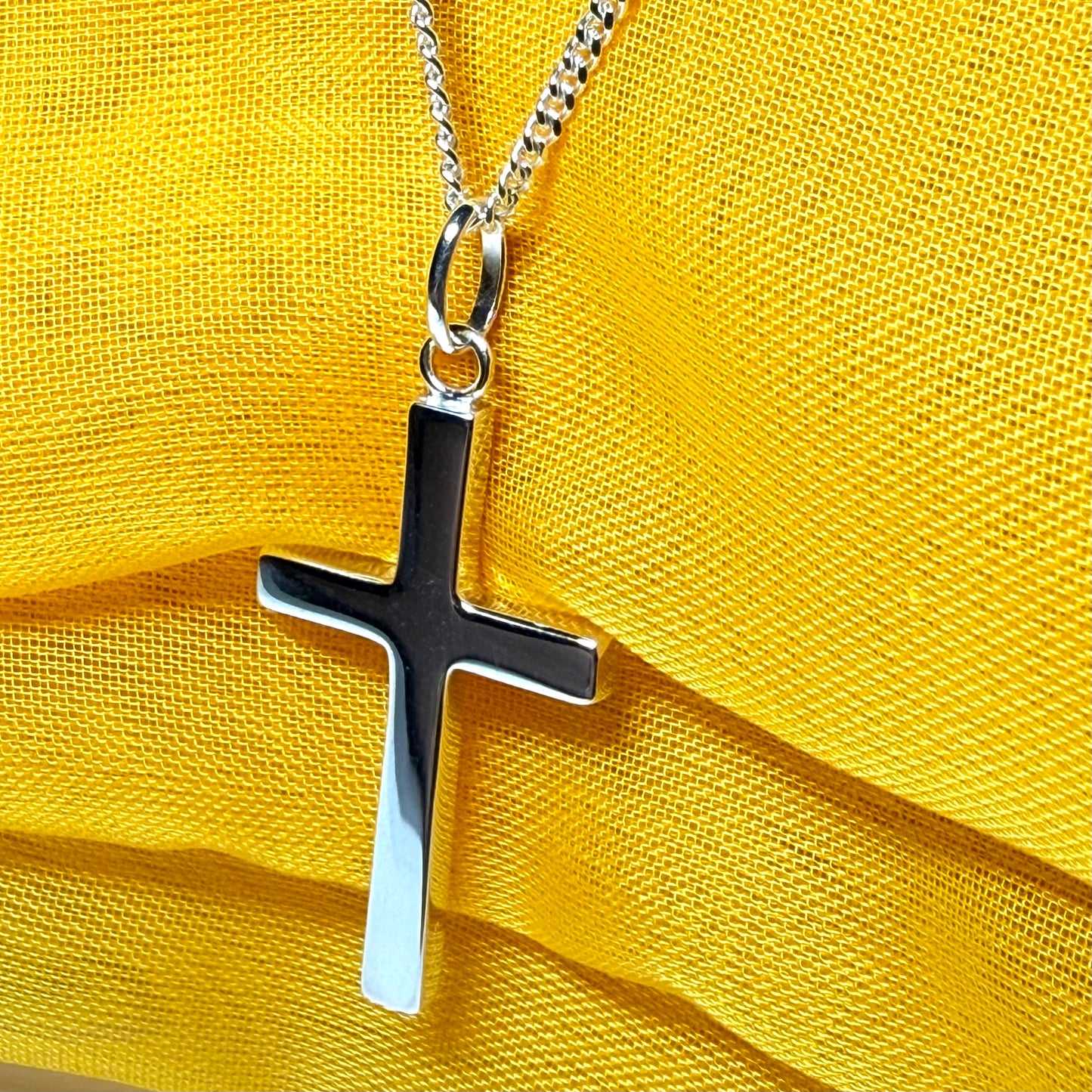 Cross and chain highly polished with an oval pendant loop on top of it chain included