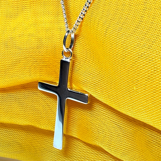 Cross and chain highly polished with an oval pendant loop on top of it chain included