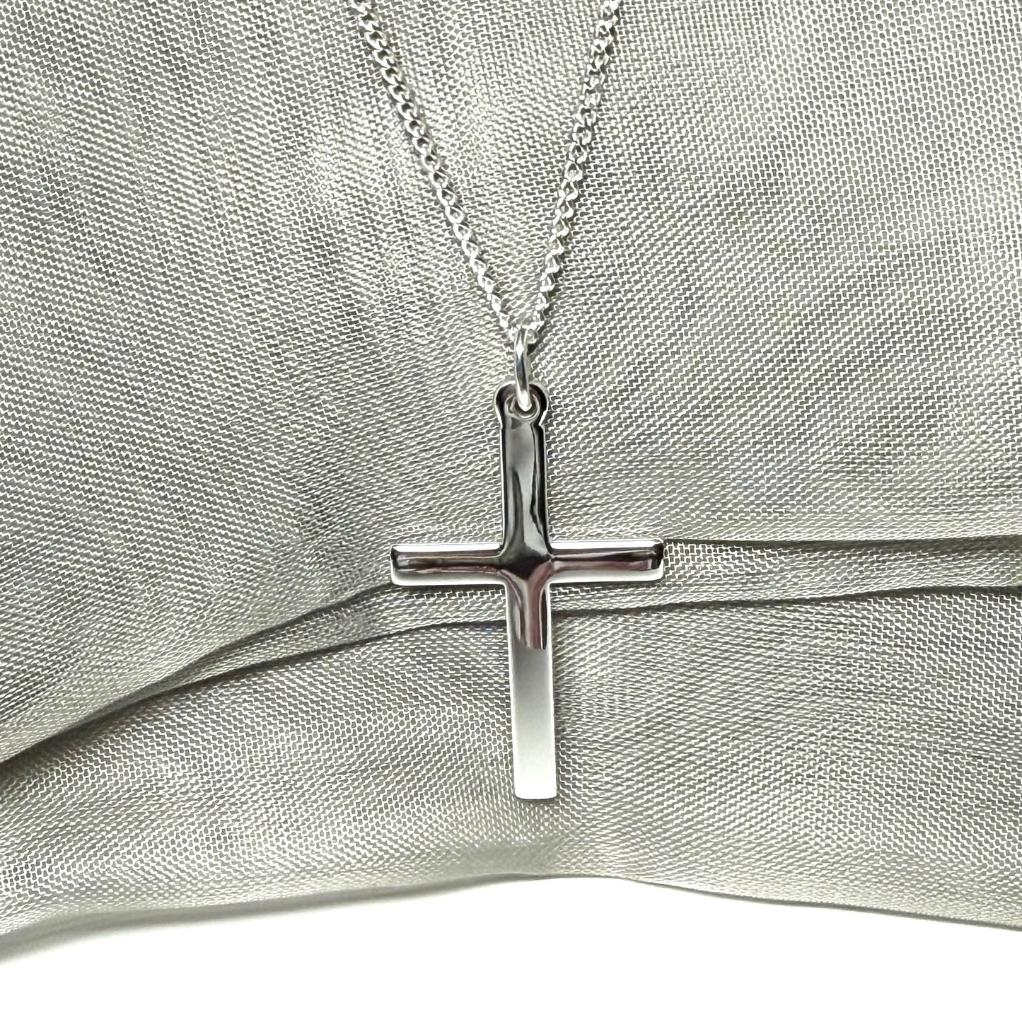 Cross and chain highly polished with a round pendant loop on top