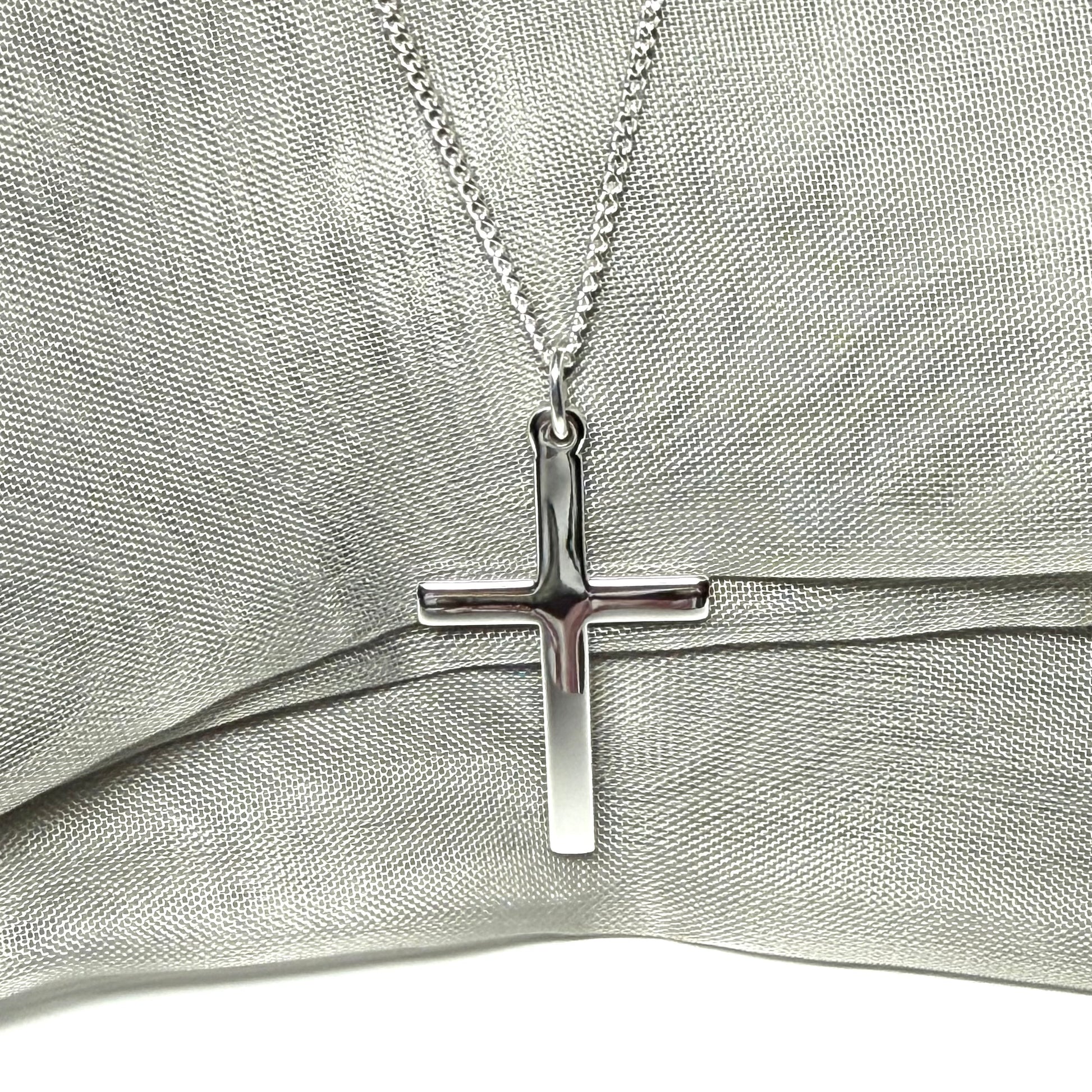 Cross and chain highly polished with a round pendant loop on top