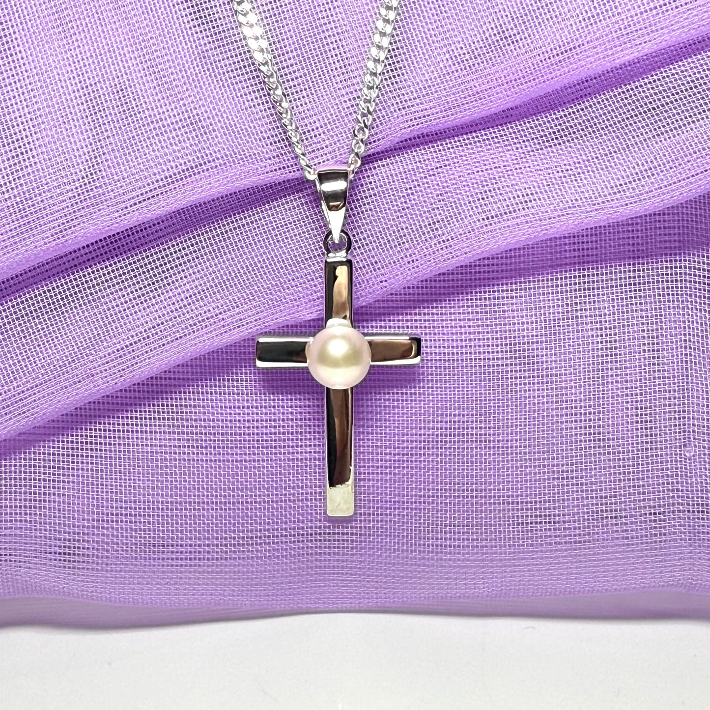 Cross necklace with a real freshwater pearl in the middle sterling silver including a chain