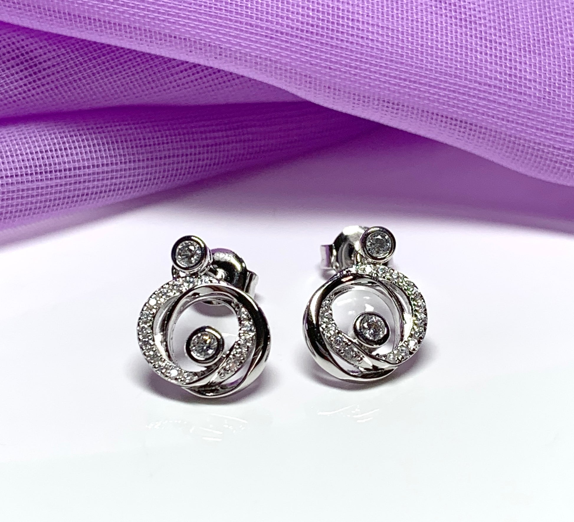 Cubic zirconia round swirl stud earrings